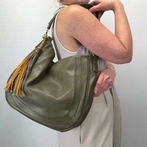 CHARMING CHARLIE Olive green tassel accent shoulder bag